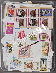 1 kilo de timbres TOUS PAYS sur fragment - TIMBRES TOUS PAYS